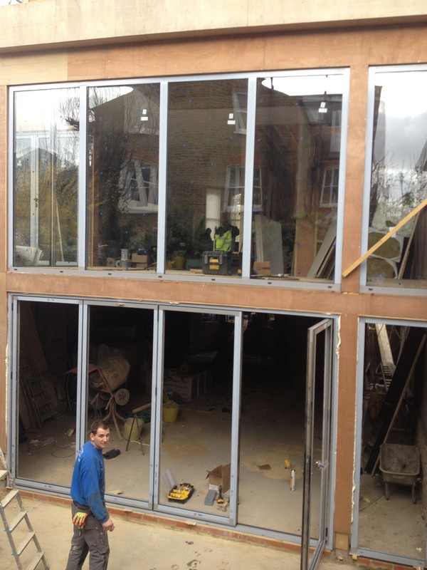 Aluminium bi-fold doors with two-storey glazing in Friern Barnet