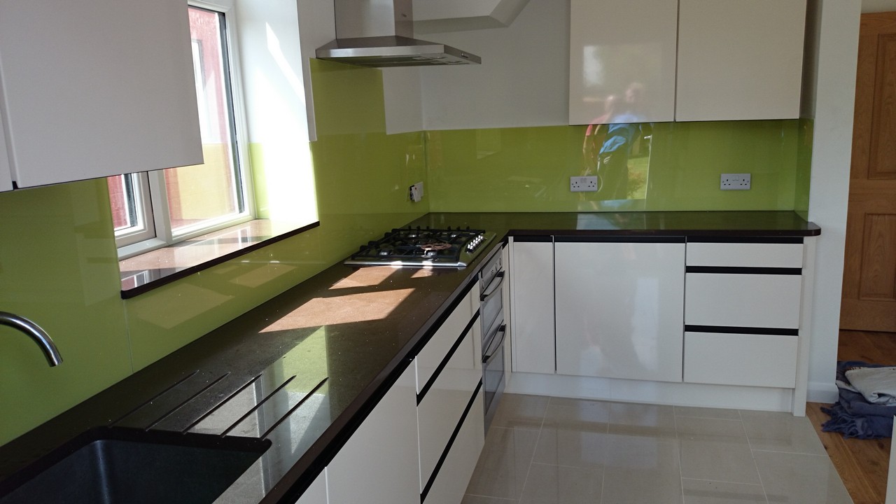 Lime green glass kitchen splashback installed by Friern Barnet glaziers