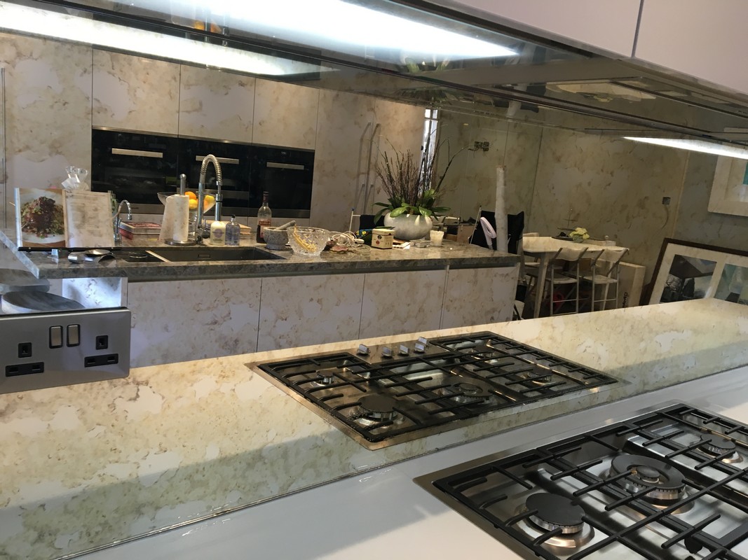 Mirror glass splashback in Friern Barnet luxury kitchen